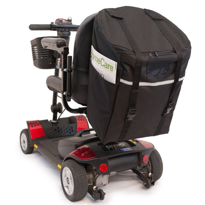 Diestco Monster Bag on a mobility scooter seatback with a magazine in the ID pocket and reflective strip