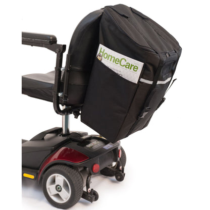 Rear three-quarter view of the Diestco Monster Bag strapped to a mobility scooter seatback with reflective strip