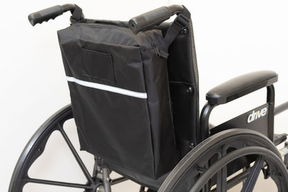 Black Diestco Standard Seatback Bag strapped to a wheelchair seatback with a reflective strip and ID pocket