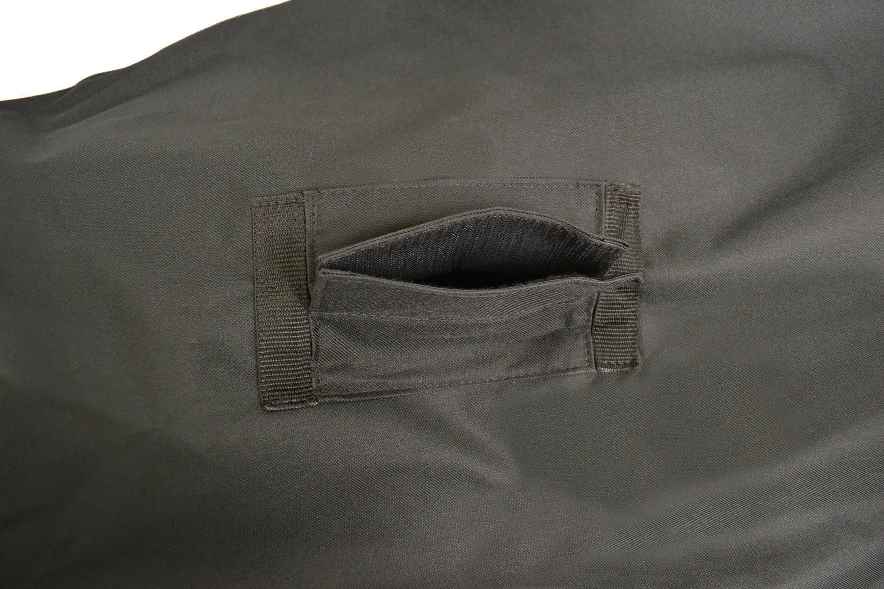 Close-up of the Diestco top slit power wheelchair cover showing the open 8-inch slit and hook-and-loop flap without a strap