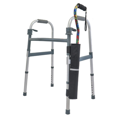 Diestco Cane Holder strapped to the vertical leg of a folding walker, holding an offset cane upright with reflective strip