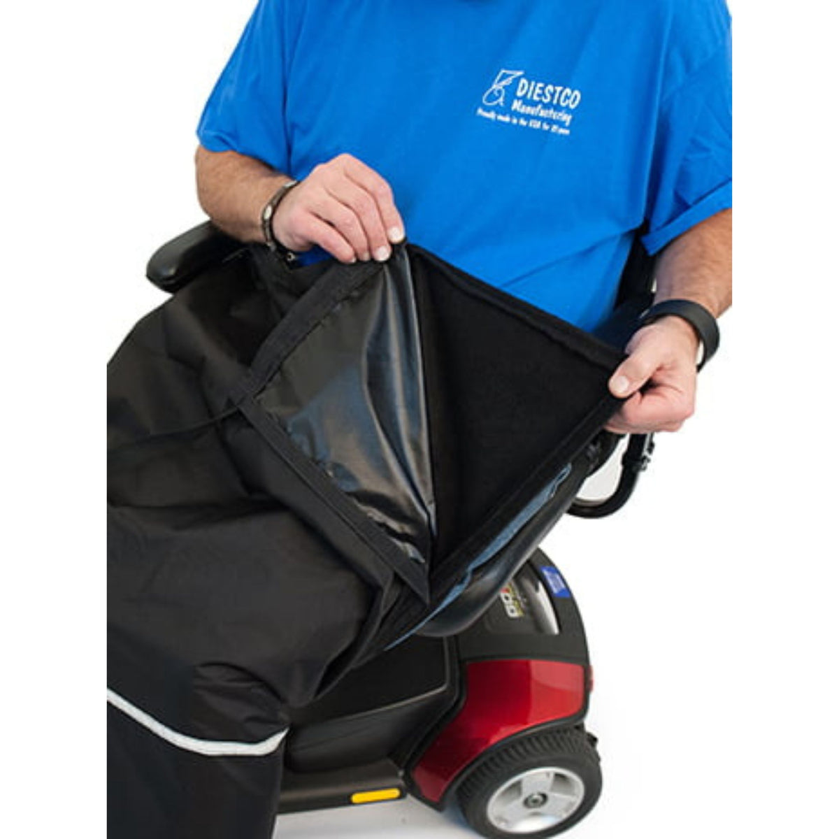 Scooter rider lifting the water-resistant shell of Diestco Weather Chaps to show the removable fleece lining underneath