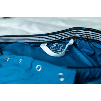 Close-up of Dignity Bath & Spa Wrap quick-drying OEKO-TEX certified fabric and label