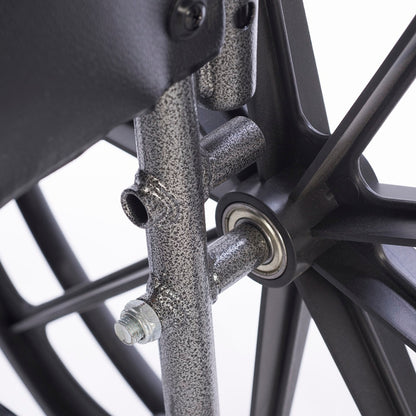 Close-up of dual axle height adjustment lever on heavy-duty bariatric wheelchair for hemi-height seat positioning and customized wheelchair mobility support.