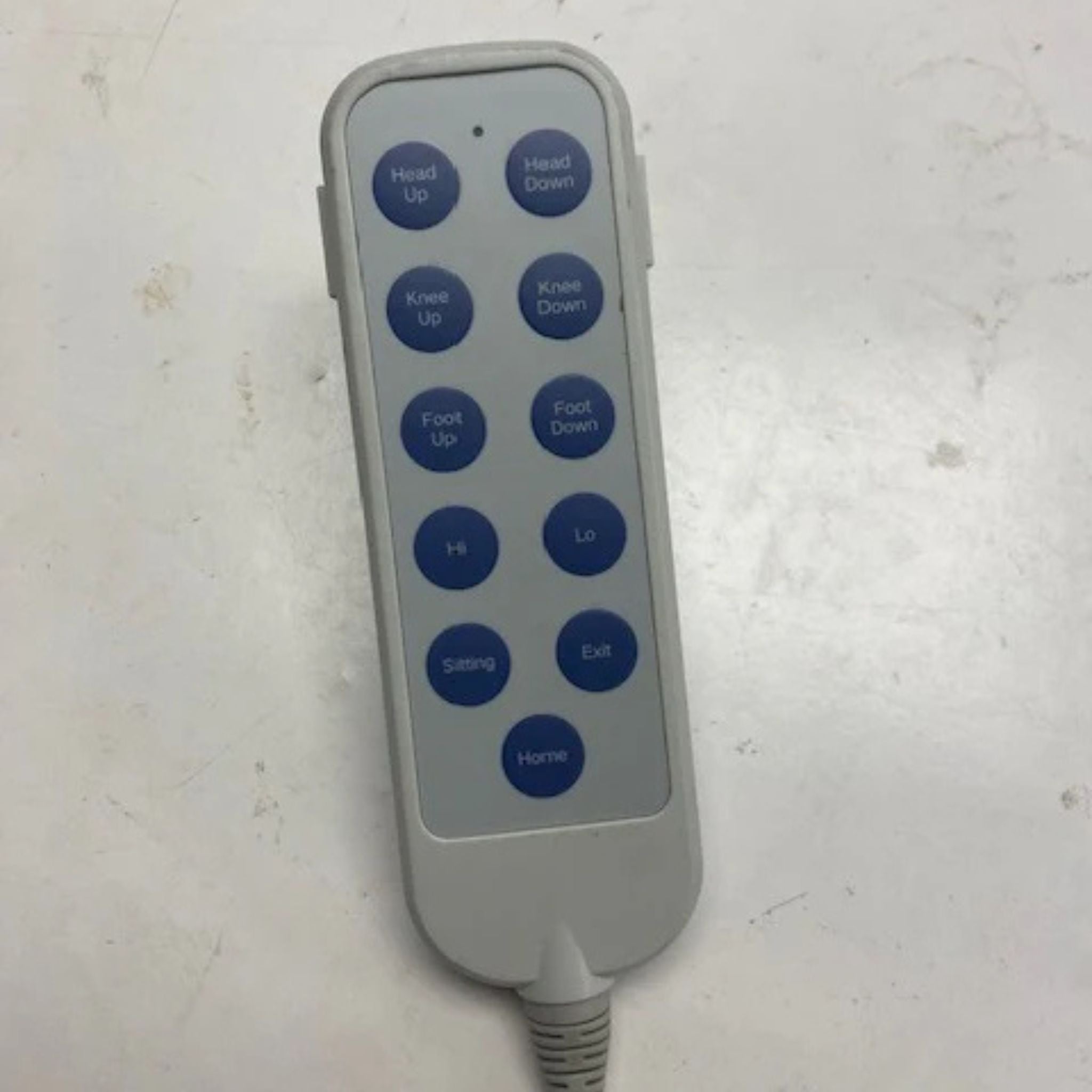 Close-up of the ENVYY Sleep-to-Stand adjustable bed remote control by Platinum Health featuring one-touch buttons for head elevation, foot adjustment, sitting position, exit assist, and Hi-Lo bed positioning functions.