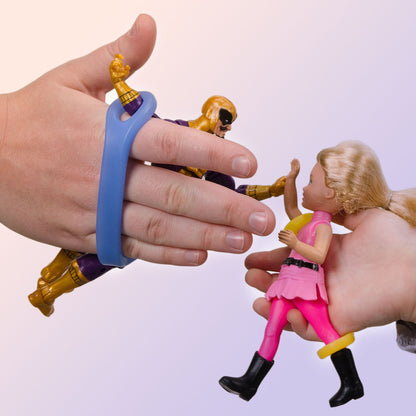 Child and adult gripping action figures with blue EaZyHold cuffs during shared playtime