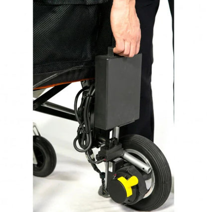 Hand lifting the removable lithium battery pack off the back of the Feather Power Chair by its handle