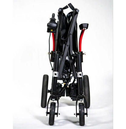 Front view of the folded Feather Power Chair showing its narrow 13 inch width and solid tires