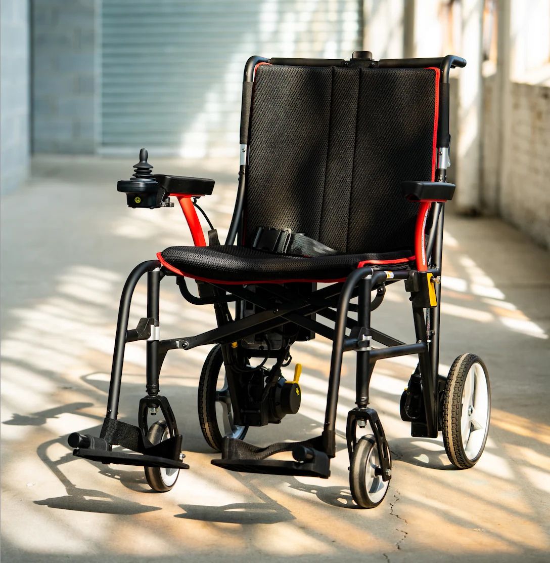 Feather Power Chair electric wheelchair with mesh seat, seat belt, left-mounted joystick and flip-back armrests