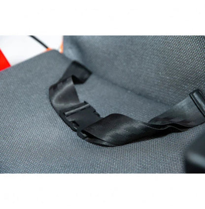 Close-up of the Feather Power Chair seat belt buckle on the padded seat cushion