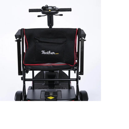 Close-up rear view of the Feather Scooter seatback, storage pocket, armrests, and tiller controls