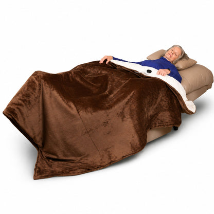 Journey Perfect Sleep Chair reclined flat with matching pillow and heated blanket for overnight comfort