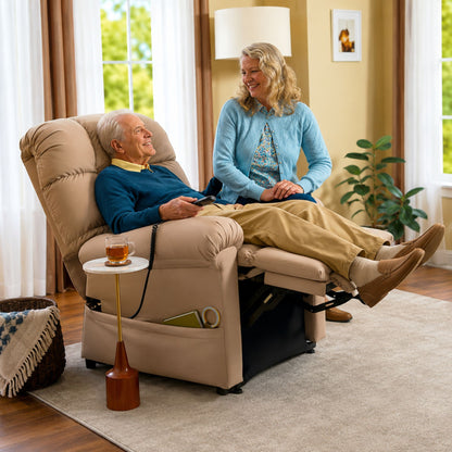 User relaxing in Journey Perfect Sleep Chair MiraLux lift recliner while visiting with caregiver