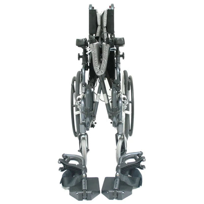 Front view of the folded Karman VIP-515 manual propel tilt-in-space wheelchair with Leg rests showing compact folding frame for transport and storage on a white background