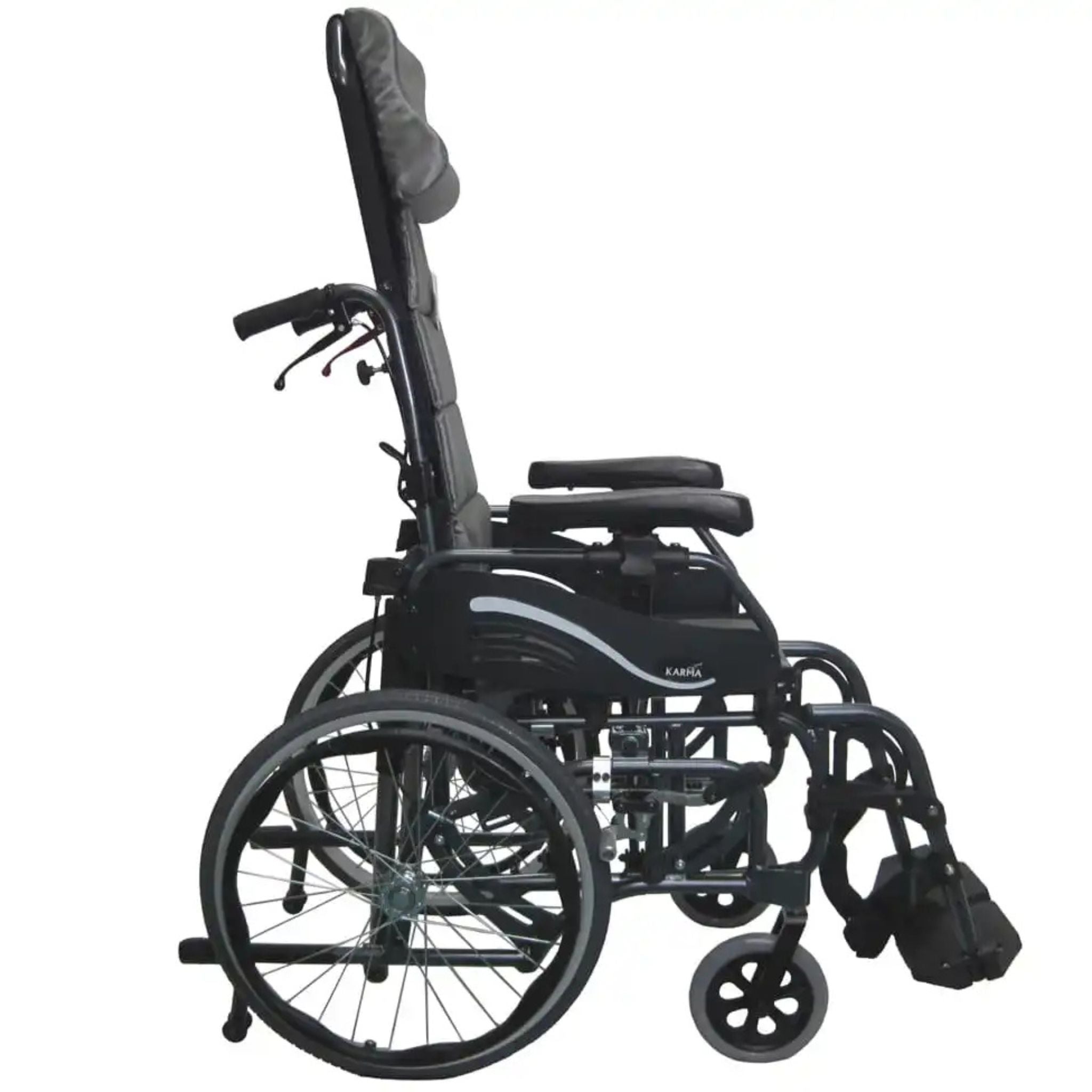 Side profile view of the Karman VIP-515 tilt-in-space manual wheelchair with 20-inch self-propel wheels, ergonomic headrest, adjustable armrests, and elevating leg rests on a white background