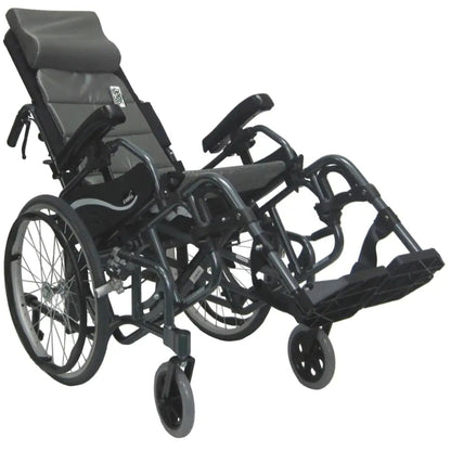 Karman VIP-515 manual propel tilt-in-space wheelchair shown in a tilted pressure relief position with elevated leg rests, padded headrest, and 20-inch rear wheels on a white background