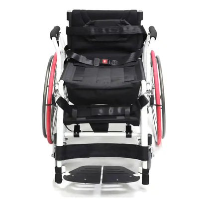 Front-facing view of the Karman XO-55 Horizon manual standing wheelchair featuring chest support harness, positioning straps, ergonomic seating system, and lightweight active mobility frame for standing rehabilitation and everyday use.
