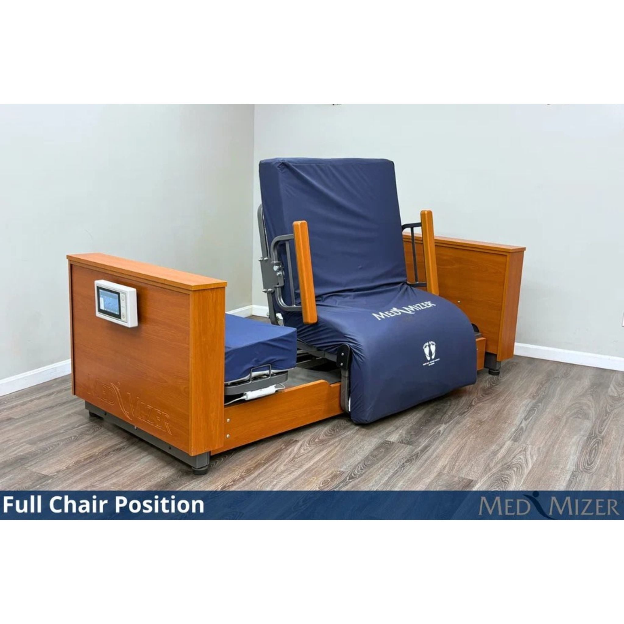 Med-Mizer ActiveCare Deluxe bed rotated to a full chair with a touchscreen controller on the footboard