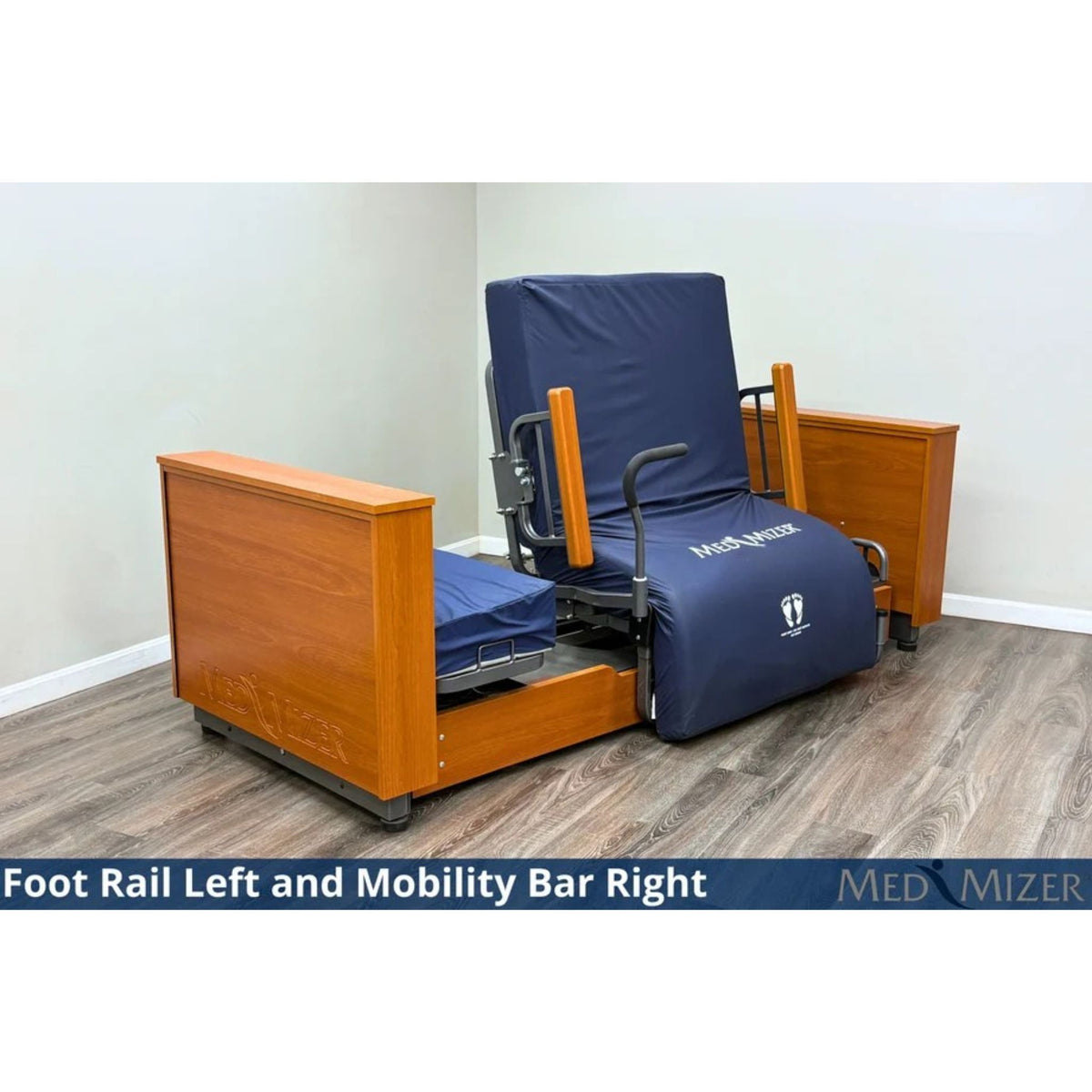 Med-Mizer ActiveCare Deluxe rotating pivot bed in a seated chair position with a foot rail and mobility bar