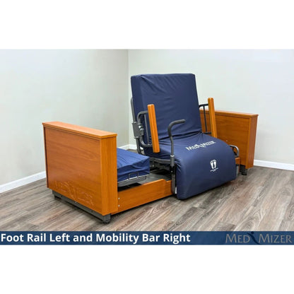 Med-Mizer ActiveCare Deluxe rotating pivot bed in a seated chair position with a foot rail and mobility bar