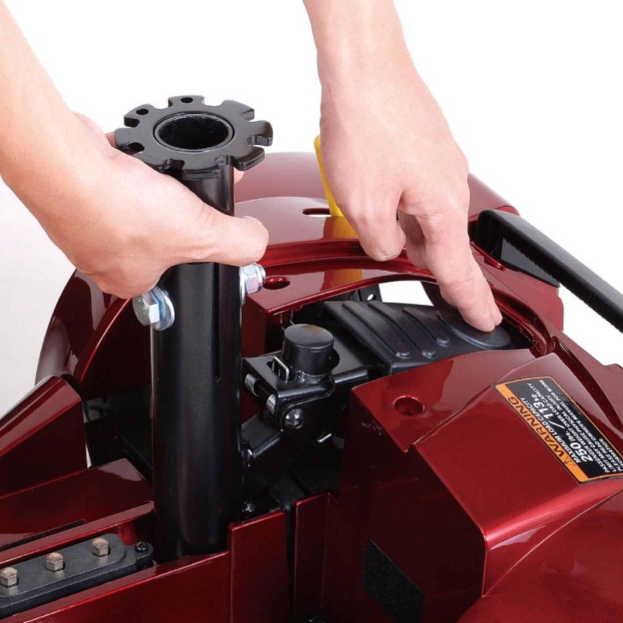 User reconnecting the Merits Roadster 3 frame using the secure auto-latching frame connection system.