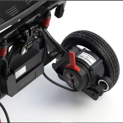 Close-up of the MM60 Carbon drive motor, removable lithium battery, and freewheel lever