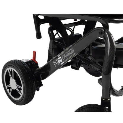 Close-up of the glossy MM60 Carbon fiber frame with branding, rear drive wheel, and red freewheel lever