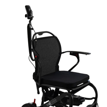 Close-up of the MM60 Carbon padded seat, breathable mesh backrest, flip-up armrest, and rear attendant control