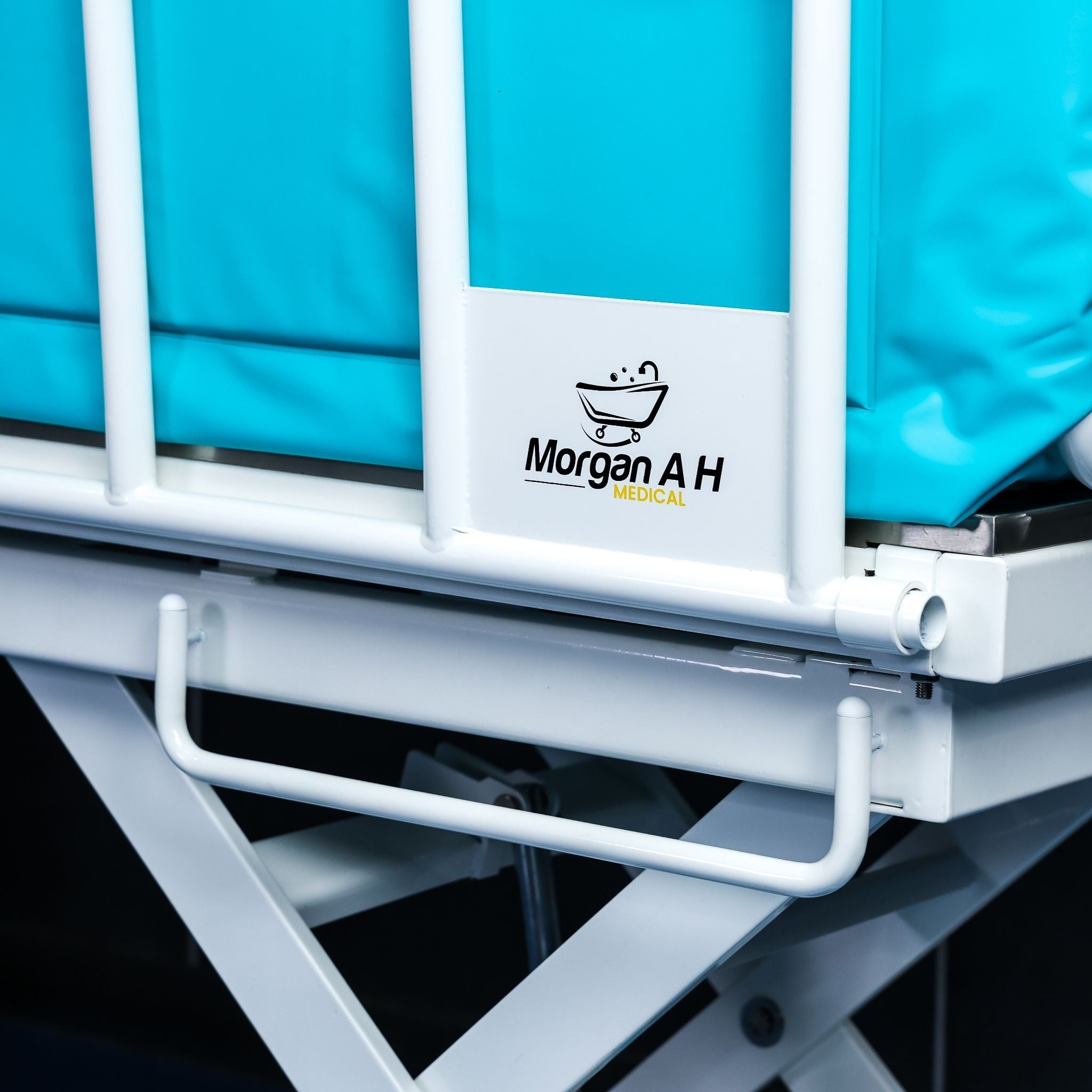 Morgan AH Medical logo displayed on protective bathing trolley side rail