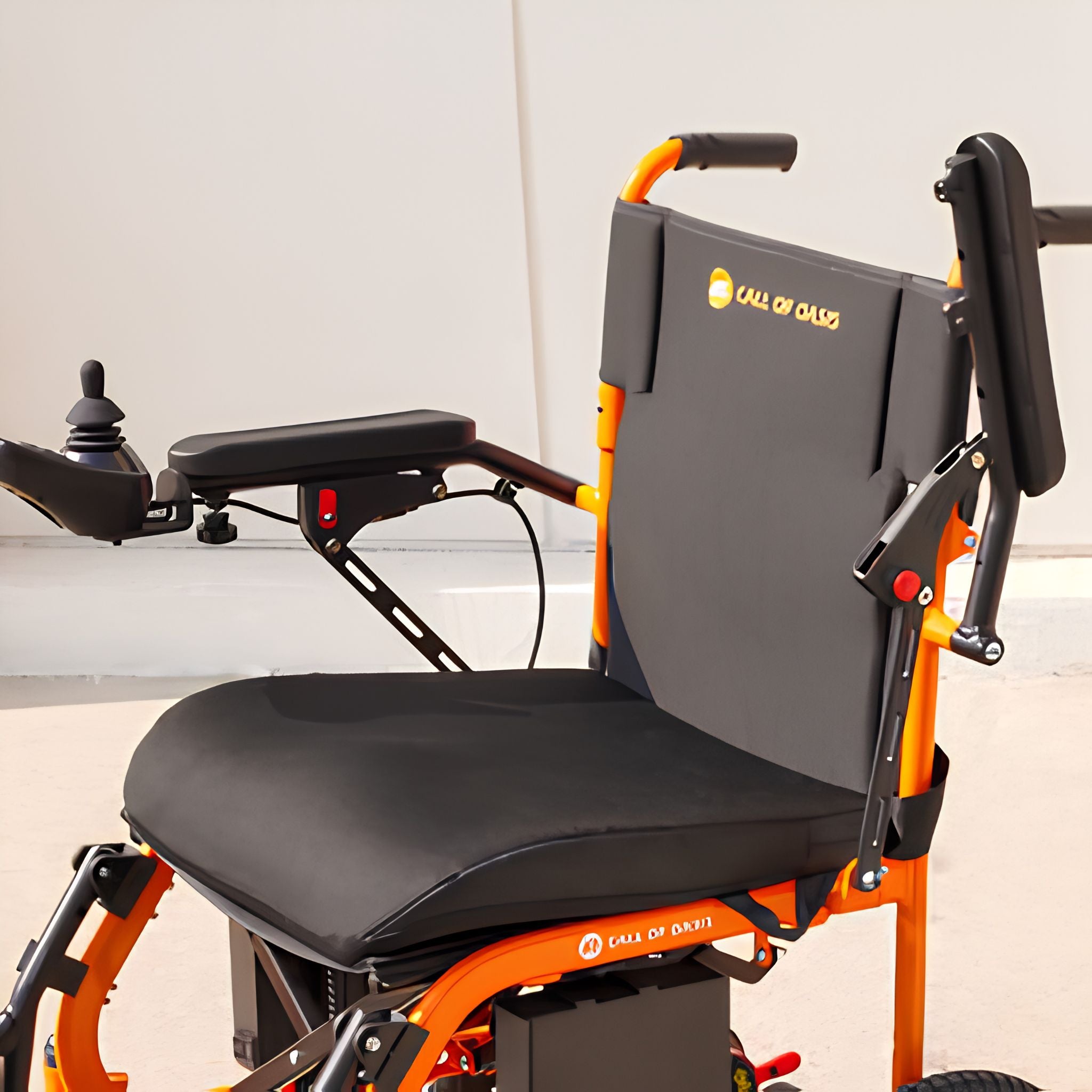 Close-up of the OAS Air Ultra padded flip-up armrest with the 360-degree joystick controller on the seat