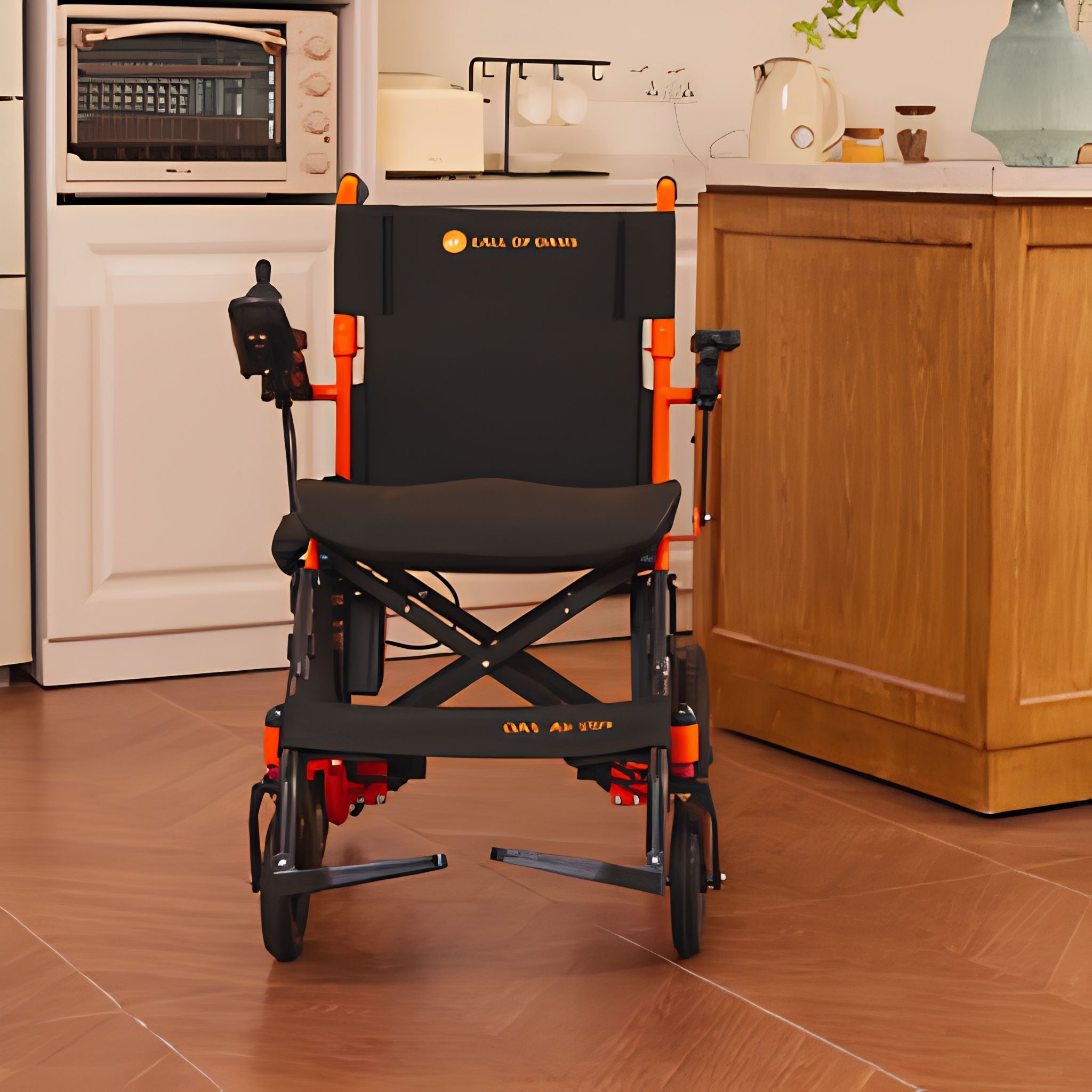 Front view of the orange OAS Air Ultra folding electric wheelchair showing its lightweight aluminum alloy frame