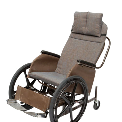 Front view of the Rock 'N Go tilt-in-space wheelchair in grey Illusion Mesquite fabric with a padded footrest