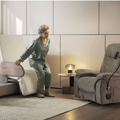 Gray-haired woman rises from the Arlo bed after it rotates into a seated position