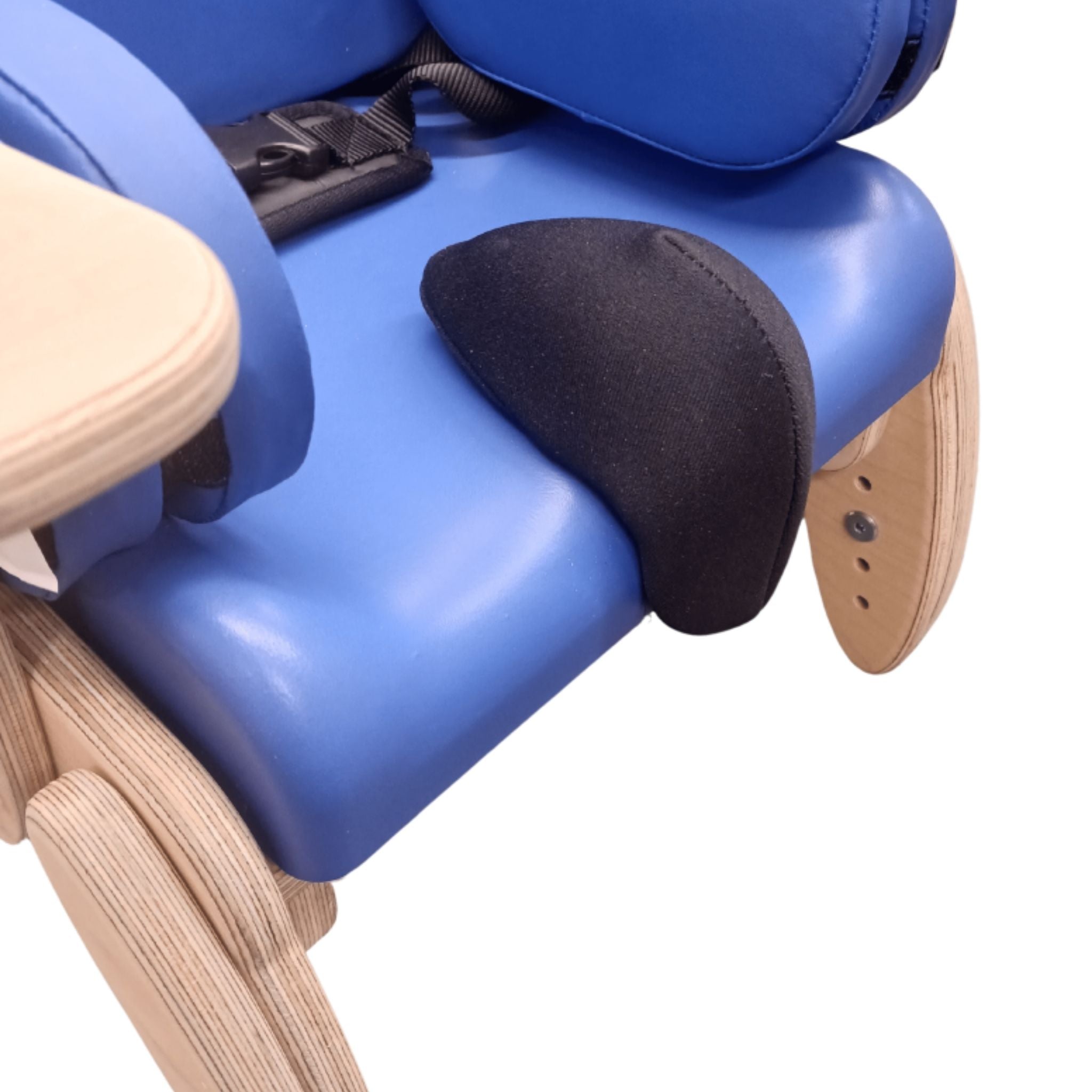 Close-up of a blue Smirthwaite Juni chair seat showing the contoured cushion and a black pommel support.