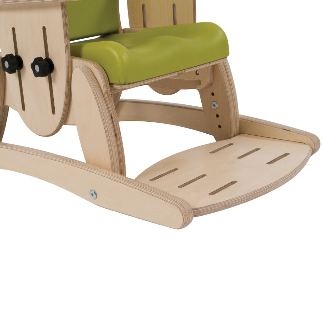 Wooden footrest and ski attached beneath a green Smirthwaite Juni chair to support the child's feet.