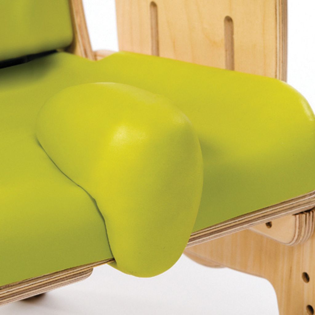 Close-up of the green Smirthwaite Juni chair pommel mounted on the seat to encourage hip abduction.