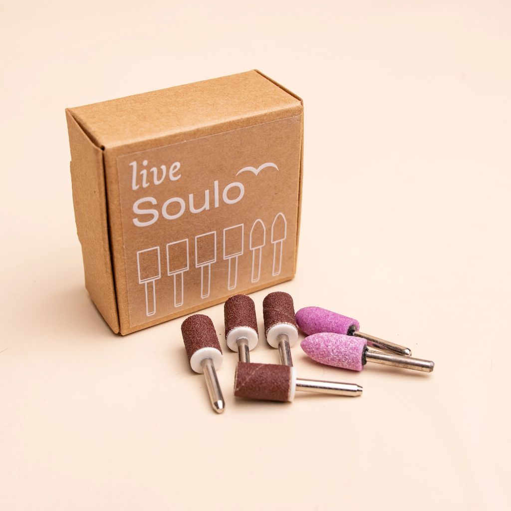 Soulo replacement tips 3-month supply with sanding bands and grinding stone tips beside a live Soulo box