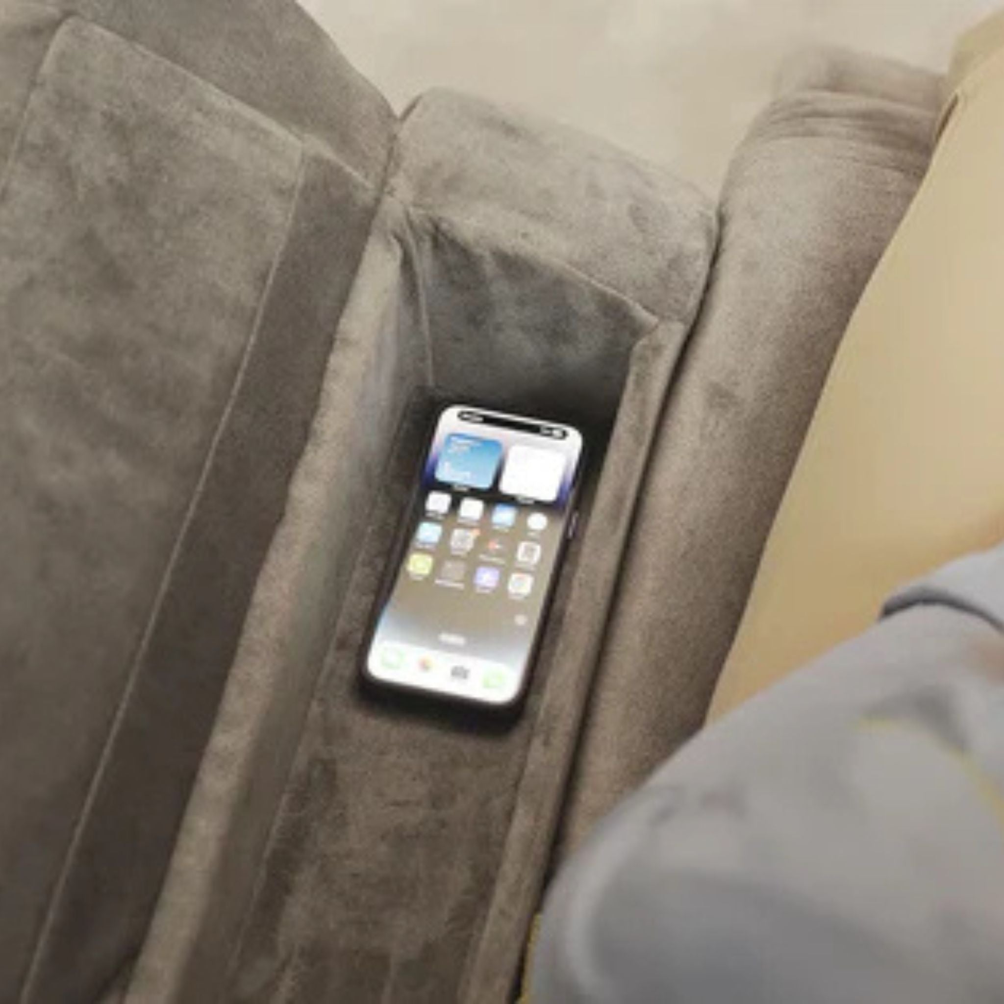 Hidden smartphone storage compartment inside Starise electric lift recliner for easy access and organization