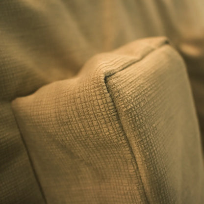 Close-up of Tausi comfort support system fabric showing soft textured upholstery stitching