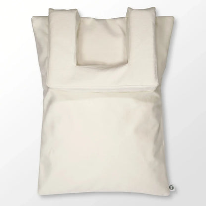 Ivory-colored Tausi Vertical Support System with integrated upper back and neck support