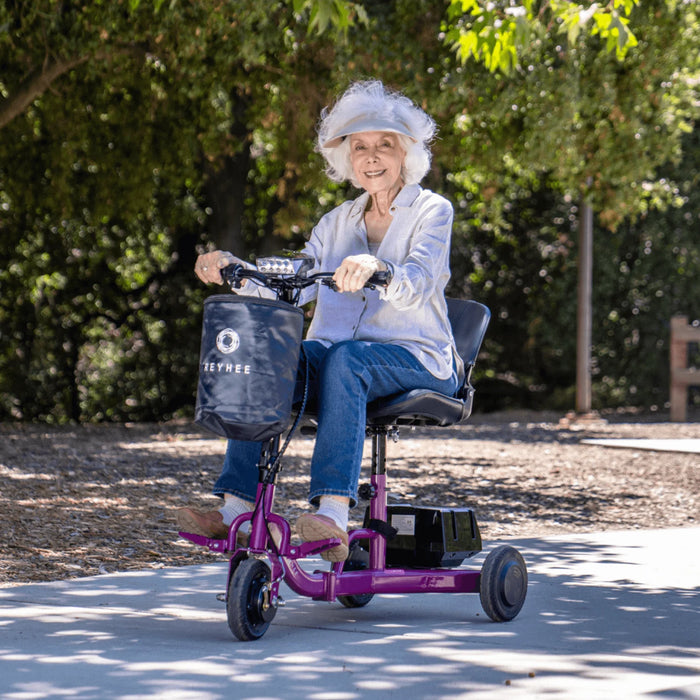 elder woman on on purple motorized scooter
