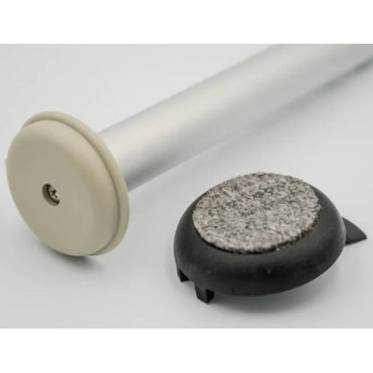Versa Coast walker footing with detached carpeted indoor coaster beside hard-surface outdoor glide, demonstrating removable dual-surface design.