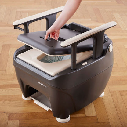 Top access lid on the Wrappon ORB auto-wrapping portable commode toilet for simplified maintenance and hygienic waste system access