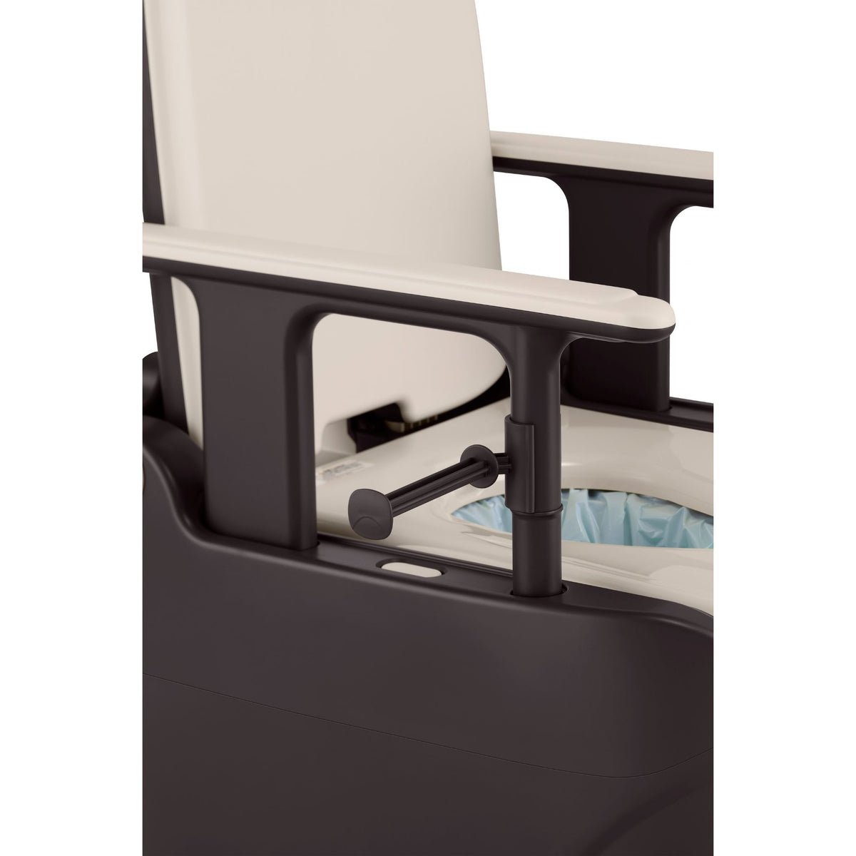 Toilet paper holder clipped onto the armrest post of the Wrappon ORB, within easy reach of the seat