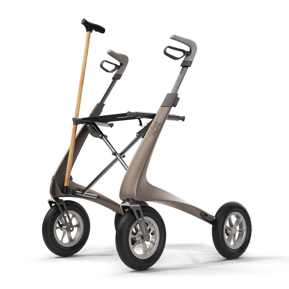 byACRE Carbon Overland rollator equipped with the cane holder accessory carrying a walking cane securely