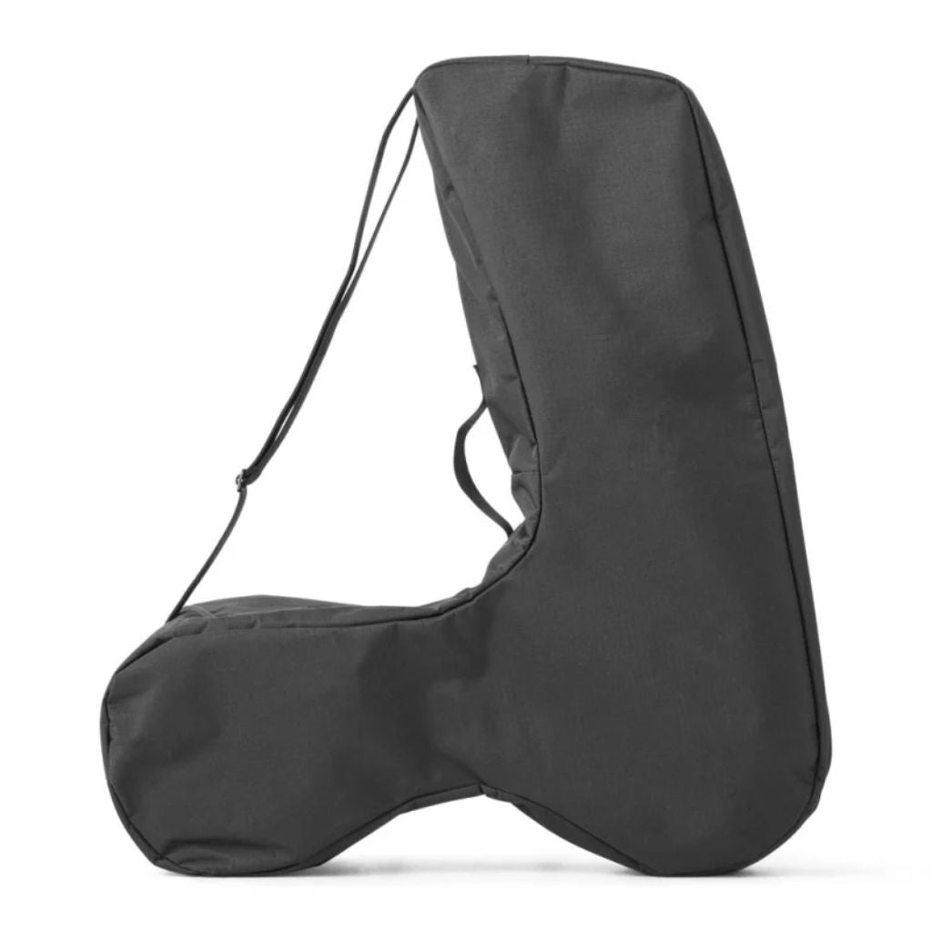 The empty black byACRE Carbon Overland travel bag standing upright with its adjustable shoulder strap