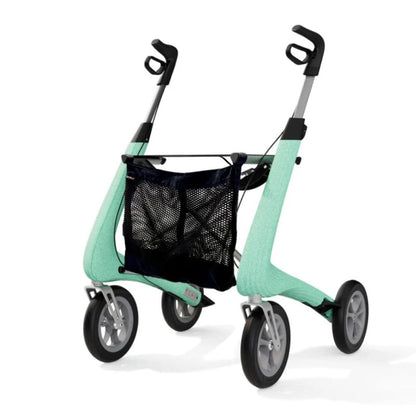 Angled view of a green byACRE Carbon Ultralight rollator with the black mesh storage bag mounted under the seat
