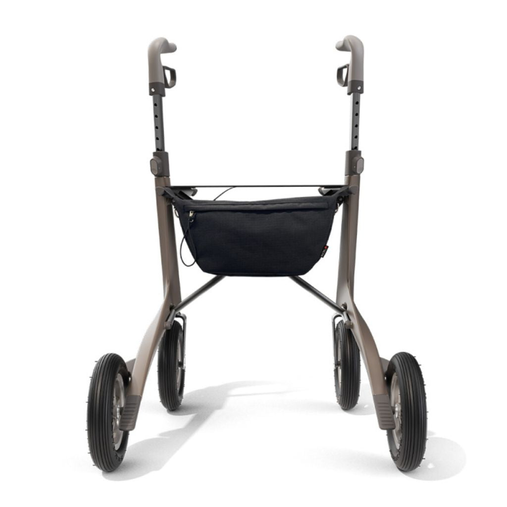 Black byACRE Pocket Bag attached under the seat of a bronze byACRE rollator, shown from the front