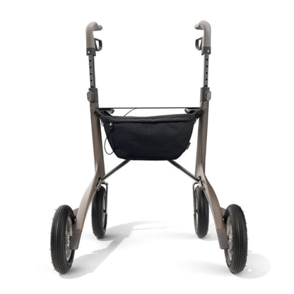 Black byACRE Pocket Bag attached under the seat of a bronze byACRE rollator, shown from the front