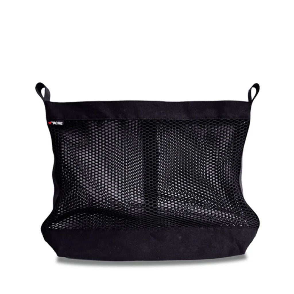 Black byACRE mesh storage bag accessory with fabric attachment loops and brand label, shown on its own